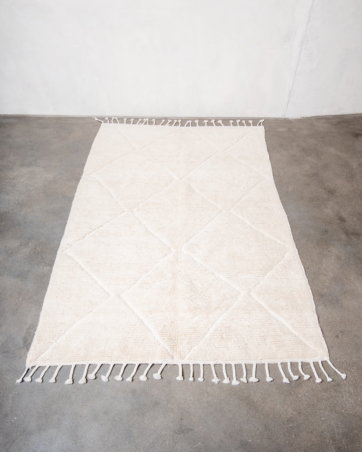 Modern, designer, handcrafted Berber rug from Morocco. Beniourain carpet with minimalist design, natural wool pile and a fluffy texture.